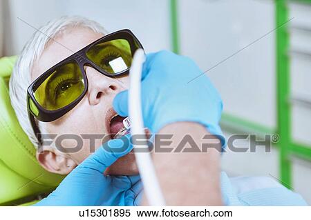 Stock Photography - Laser teeth whitening. Fotosearch