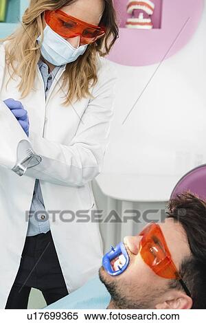 Laser teeth whitening View Large Photo Image Stock Photography - Laser teeth whitening. Fotosearch
