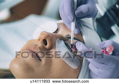 Stock Image - Lash lifting in beauty salon. Fotosearch
