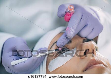 Stock Image - Lash lifting in beauty salon. Fotosearch