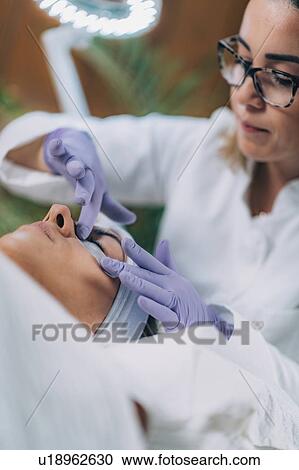 Stock Image - Lash lifting in beauty salon. Fotosearch