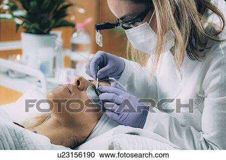 Stock Image - Lash lifting in beauty salon. Fotosearch