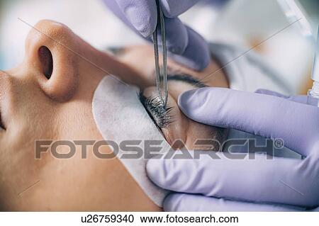 Stock Image - Lash lifting in beauty salon. Fotosearch