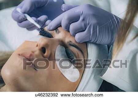 Stock Image - Lash lifting in beauty salon. Fotosearch