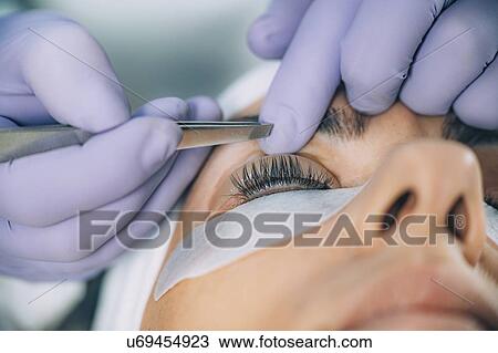 Stock Image - Lash lifting in beauty salon. Fotosearch
