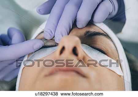 Stock Photo - Lash lifting in beauty salon. Fotosearch