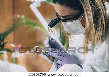 Stock Photo - Lash lifting in beauty salon. Fotosearch