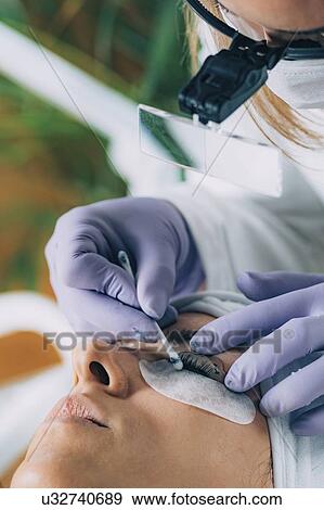 Stock Photo - Lash lifting in beauty salon. Fotosearch