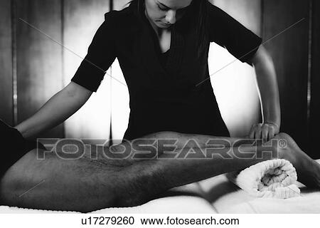 Stock Image - Leg massage. Fotosearch