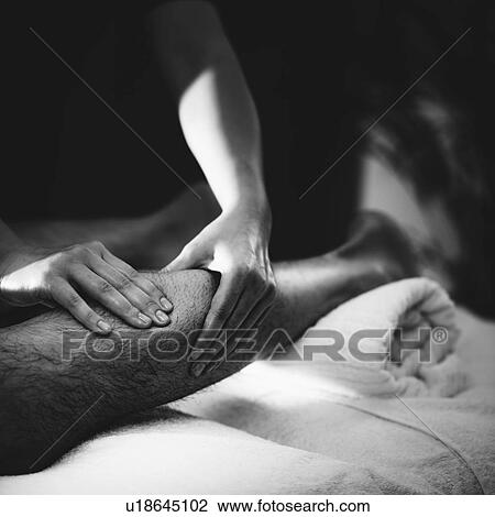 Stock Image - Leg massage. Fotosearch