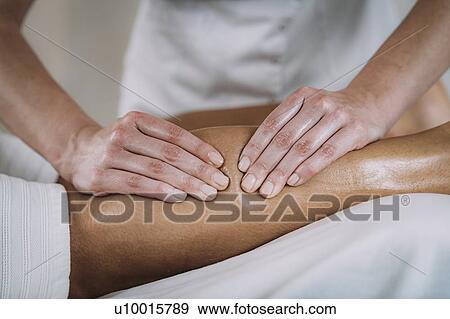 Stock Photo - Leg massage. Fotosearch