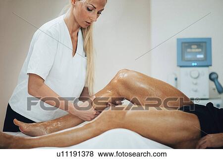 Stock Photo - Leg massage. Fotosearch