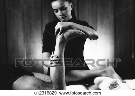 Stock Photo - Leg massage. Fotosearch