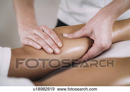 Stock Photo - Leg massage. Fotosearch
