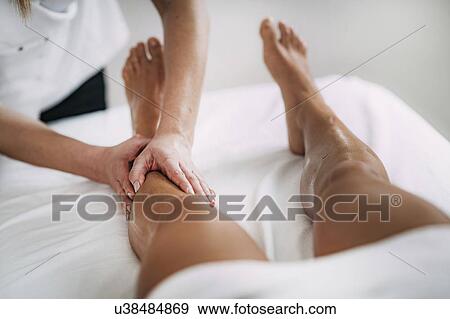 Leg massage View Large Photo Image Stock Photo - Leg massage. Fotosearch