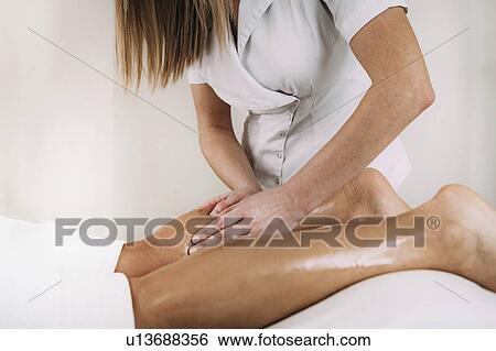 Leg massage View Large Photo Image Stock Photograph - Leg massage. Fotosearch