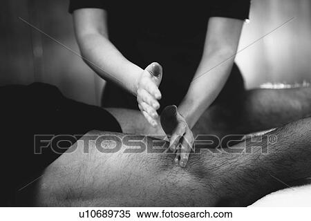 Stock Photography - Leg massage. Fotosearch