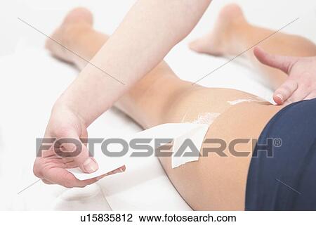 Stock Image - Leg waxing. Fotosearch