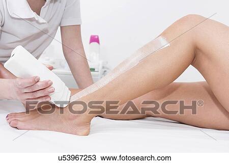 Stock Image - Leg waxing. Fotosearch