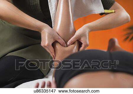 Stock Photo - Legs Sports Massage Therapy. Fotosearch