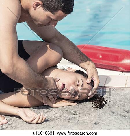 Lifeguard helping woman View Large Photo Image Stock Image - Lifeguard helping woman. Fotosearch