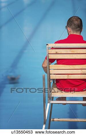 Lifeguard in chair View Large Photo Image Stock Image - Lifeguard in chair. Fotosearch