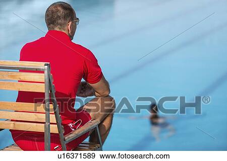 Lifeguard in chair View Large Photo Image Stock Photo - Lifeguard in chair. Fotosearch