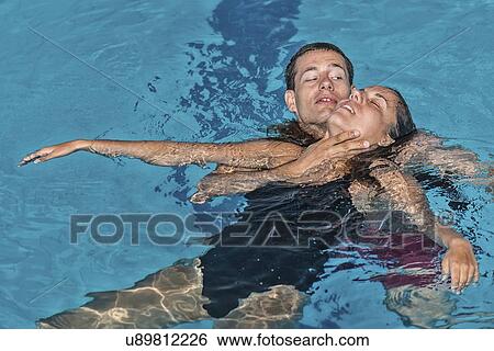 Lifeguard rescuing woman View Large Photo Image Stock Photograph - Lifeguard rescuing woman. Fotosearch