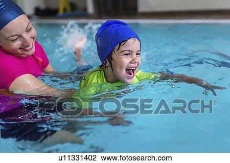 Little boy learning to swim View Large Photo Image Stock Image - Little boy learning to swim. Fotosearch