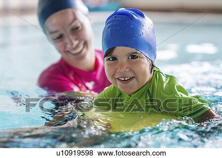 Little boy learning to swim View Large Photo Image Stock Photo - Little boy learning to swim. Fotosearch