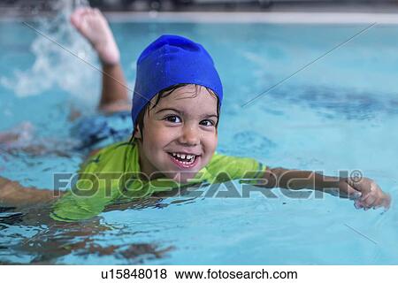 Stock Photo - Little boy learning to swim. Fotosearch