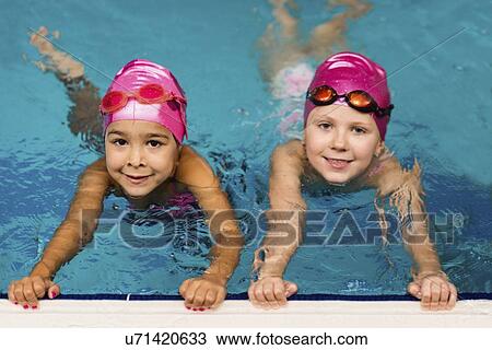 Little girls in swimming pool View Large Photo Image Stock Image - Little girls in swimming pool. Fotosearch