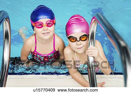 Little girls in swimming pool View Large Photo Image Stock Photo - Little girls in swimming pool. Fotosearch