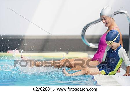 Stock Photography - Lots of fun in swimming class. Fotosearch