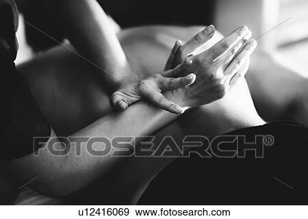 Stock Photo - Lower back massage. Fotosearch