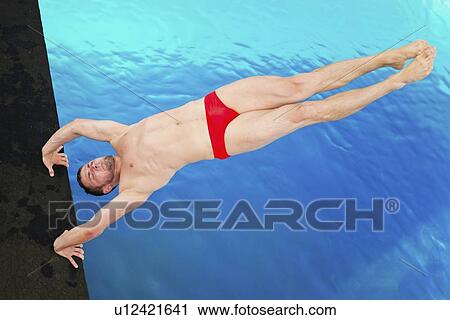 Male diver in handstand on diving platform View Large Photo Image Stock Image - Male diver in handstand on diving platform. Fotosearch