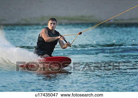 Man kneeboarding View Large Photo Image Stock Photo - Man kneeboarding. Fotosearch