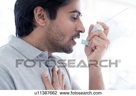 Man using inhaler View Large Photo Image Stock Image - Man using inhaler. Fotosearch