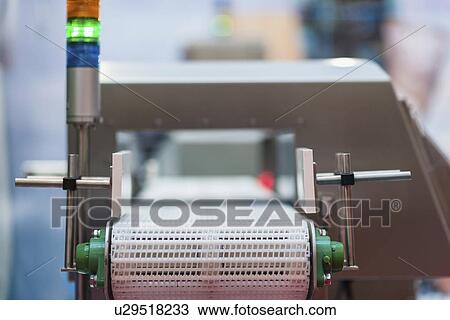 Stock Image - Metal detecting conveyor belt. Fotosearch