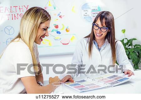 Nutritionist with female patient View Large Photo Image Stock Photo - Nutritionist with female patient. Fotosearch