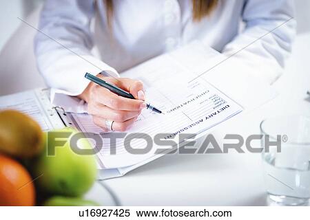 Stock Photography - Nutritionist with female patient. Fotosearch