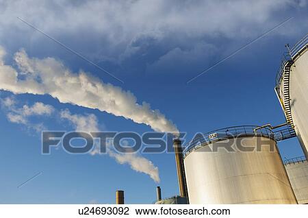 Stock Image - Oil refinery storage tanks. Fotosearch
