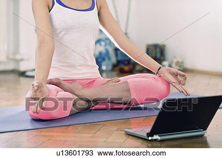 Stock Image - Online yoga class. Fotosearch