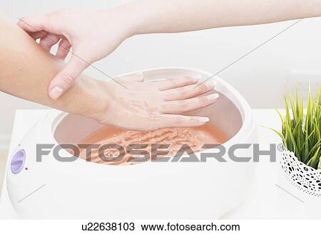 Paraffin wax hand treatment View Large Photo Image Stock Image - Paraffin wax hand treatment. Fotosearch
