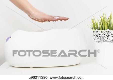Paraffin wax hand treatment View Large Photo Image Stock Image - Paraffin wax hand treatment. Fotosearch