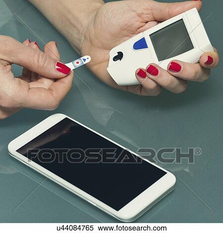 Stock Photography - Personal blood glucose meter. Fotosearch