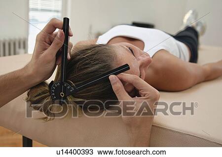 Physiotherapist measuring neck mobility View Large Photo Image Stock Image - Physiotherapist measuring neck mobility. Fotosearch