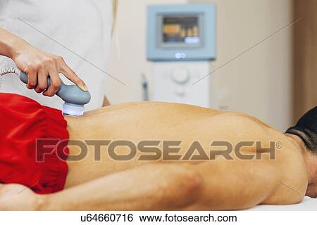 Physiotherapist using ultrasound View Large Photo Image Stock Photograph - Physiotherapist using ultrasound. Fotosearch