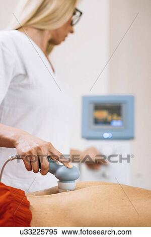 Physiotherapist using ultrasound View Large Photo Image Stock Photography - Physiotherapist using ultrasound. Fotosearch
