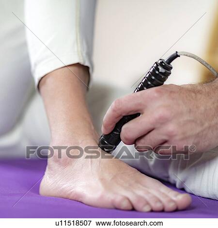 Physiotherapy laser treatment View Large Photo Image Stock Photo - Physiotherapy laser treatment. Fotosearch